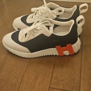 Hermes Black and White Sneakers with Orange Accent